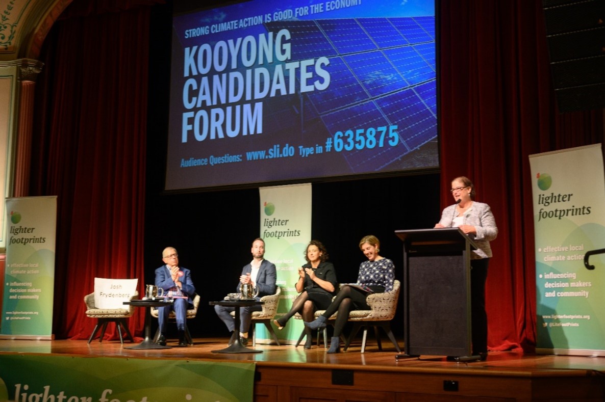 The three candidates on stage with Lighter Footprints co-convenor Lynn Frankes